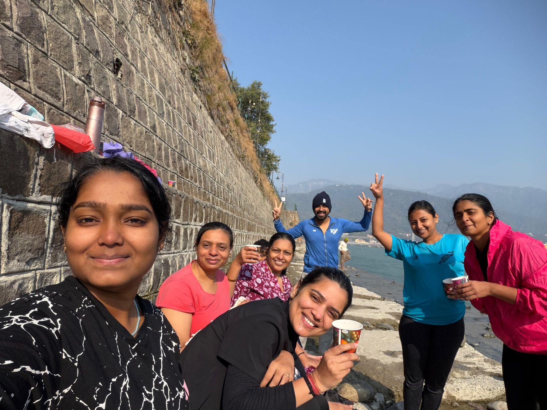 Group by the Ganga ghat wall